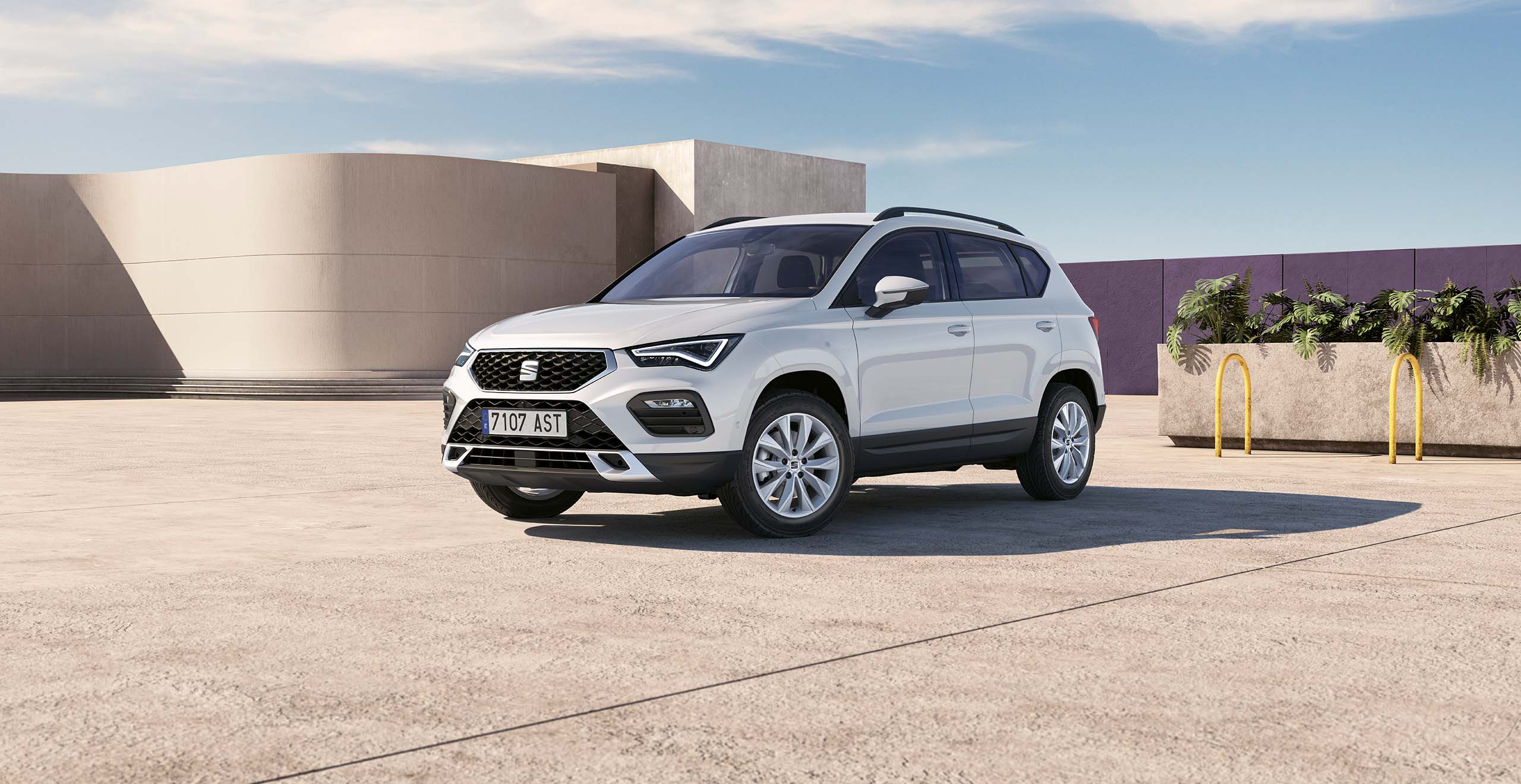 New SEAT Ateca in dark camouflage exterior rear side view with reflex silver accents.